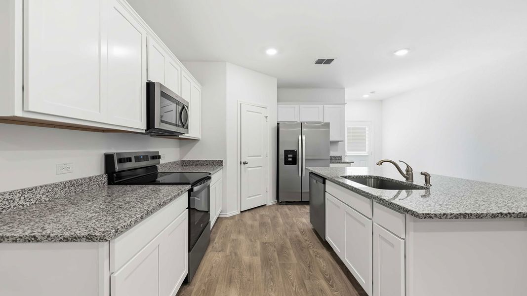 Representative furnished interior of a home built from the The Magnolia by D.R. Horton in Palomino, Manor (Image 8).
