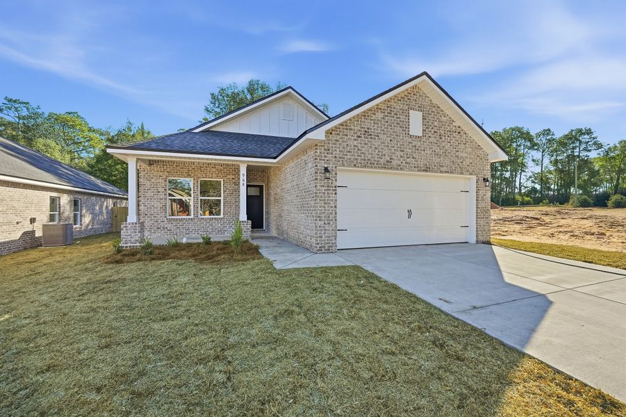Front exterior of a new home in McCarthy Estates, Defuniak Springs, FL, highlighting curb appeal (Image 2). Front exterior of a new home in McCarthy Estates, Defuniak Springs, FL, highlighting curb appeal (Image 2).