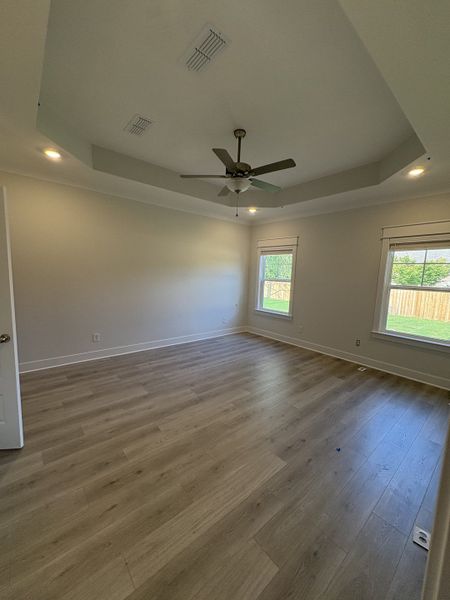 Primary Bedroom with laminate flooring throughout Primary Bedroom with laminate flooring throughout