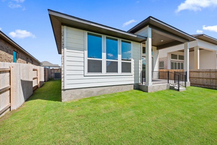 Exterior details and patio area of a home in Lariat, Liberty Hill (Image 27).