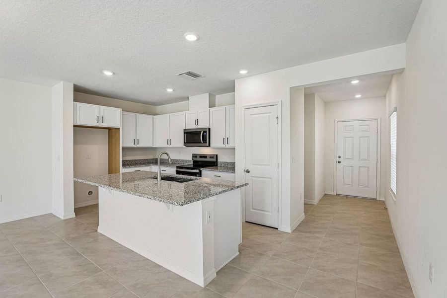 Furnished interior view inside a new home in Reserve at Forest Lake Townhomes, Lake Wales (Image 6).