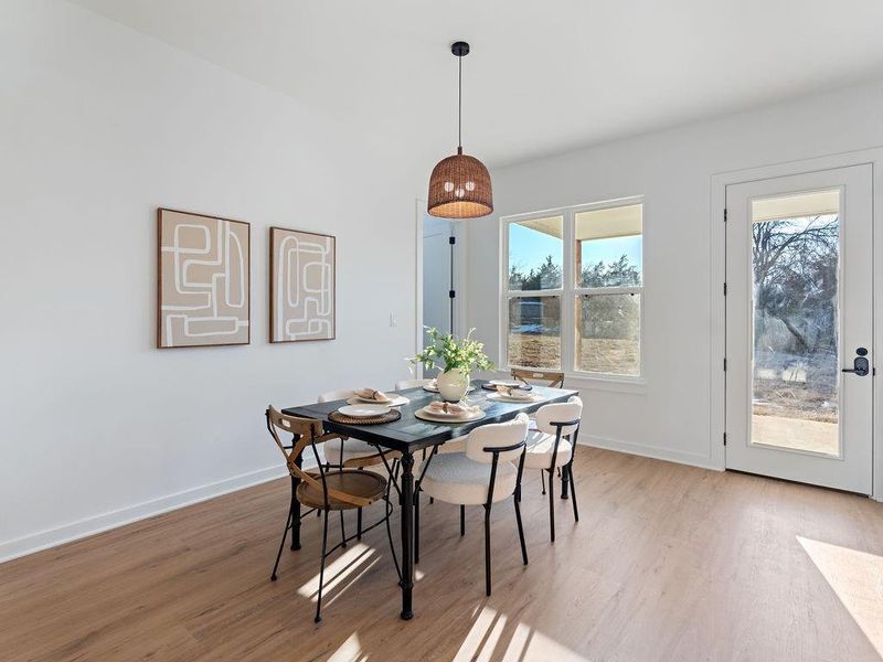 Dining space with light wood-type flooring