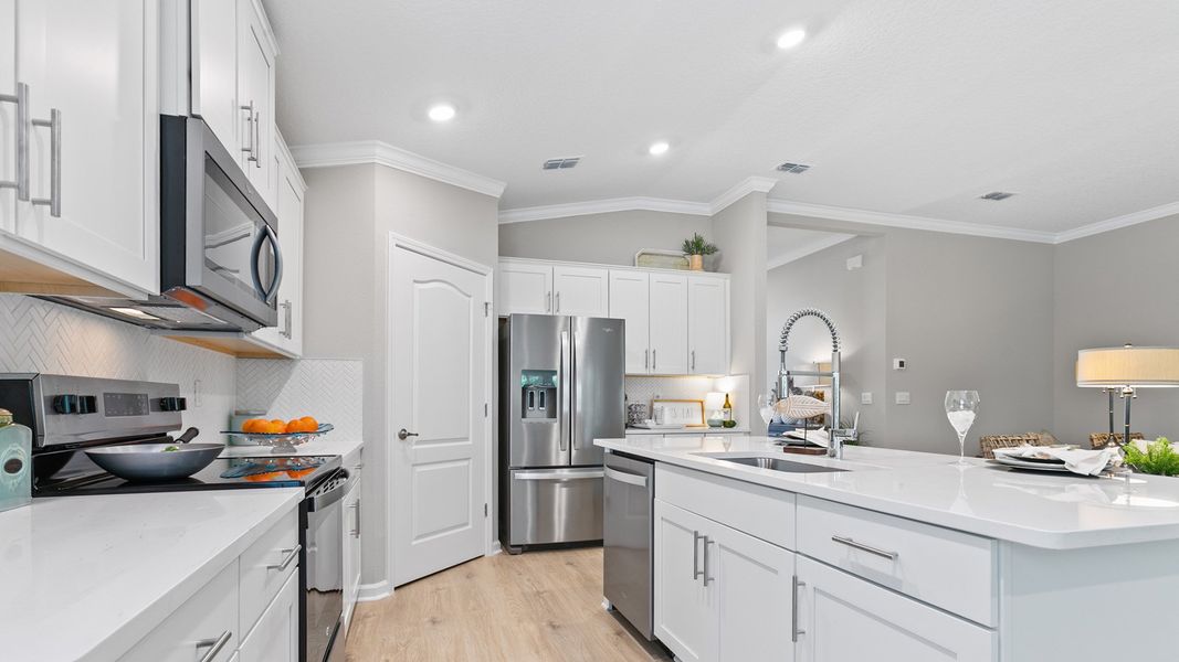 Representative furnished interior of a home built from the Dalton by D.R. Horton in American Village, Palm Coast (Image 8).