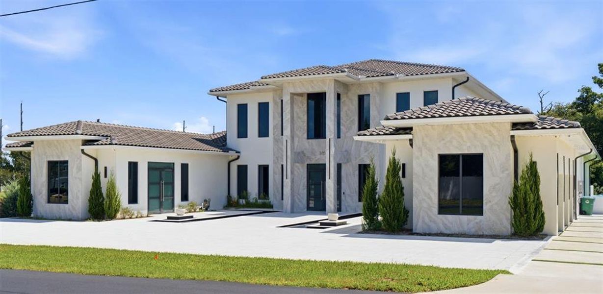 Front exterior of a new home in , Lake Mary, FL, highlighting curb appeal (Image 2). Front exterior of a new home in , Lake Mary, FL, highlighting curb appeal (Image 2).