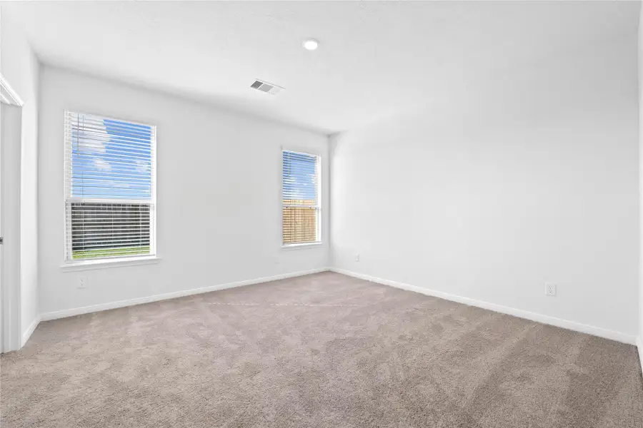 Unwind in your private sanctuary. This tranquil primary suite is a true retreat, offering a sense of calm and luxury. With plush carpeting, walk-in closet, and en-suite bath, it's the perfect place to start and end your day. Unwind in your private sanctuary. This tranquil primary suite is a true retreat, offering a sense of calm and luxury. With plush carpeting, walk-in closet, and en-suite bath, it's the perfect place to start and end your day.