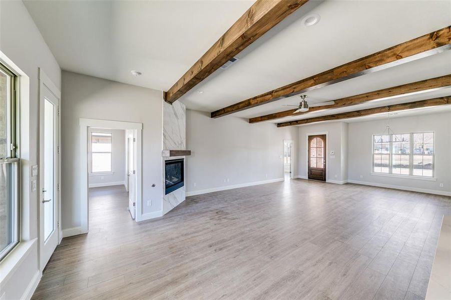 Wood beams accent the living room. Wood beams accent the living room.