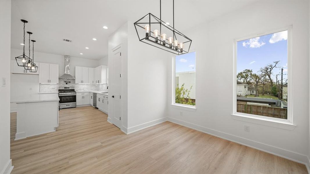 The dining room has direct access to the kitchen, and living space.