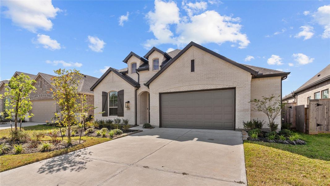 Front exterior of a new home in , Conroe, TX, highlighting curb appeal (Image 2). Front exterior of a new home in , Conroe, TX, highlighting curb appeal (Image 2).