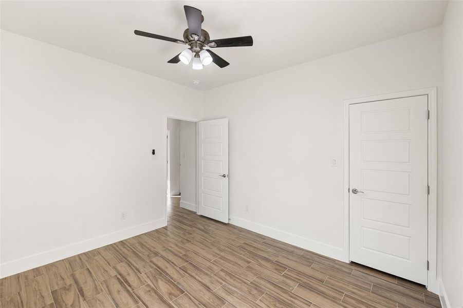 Spare room featuring ceiling fan and light hardwood / wood-style floors