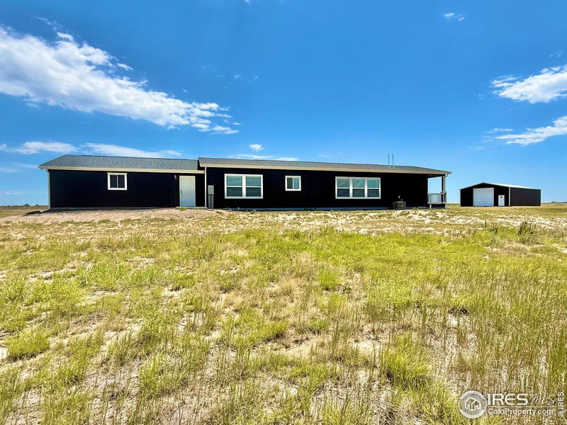 Exterior details and patio area of a home in , Briggsdale (Image 3).