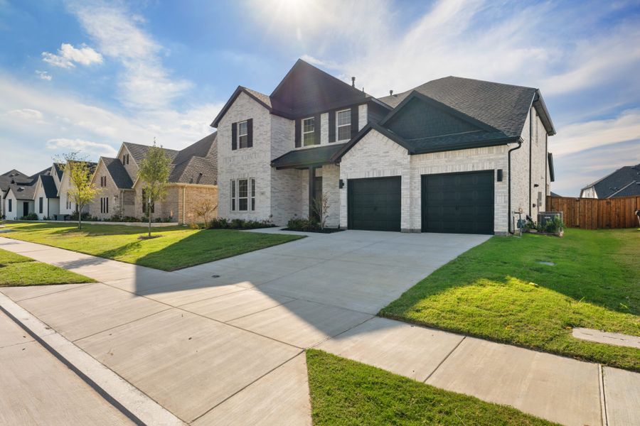 Front exterior of a new home in Lake Breeze, Lavon, TX, highlighting curb appeal (Image 22).