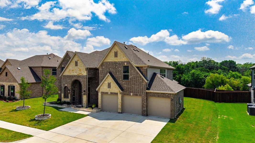 Front exterior of a new home in Grayhawk Addition, Forney, TX, highlighting curb appeal (Image 23).