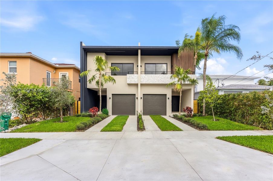 Front exterior of a new home in , Miami, FL, highlighting curb appeal (Image 1). Front exterior of a new home in , Miami, FL, highlighting curb appeal (Image 1).