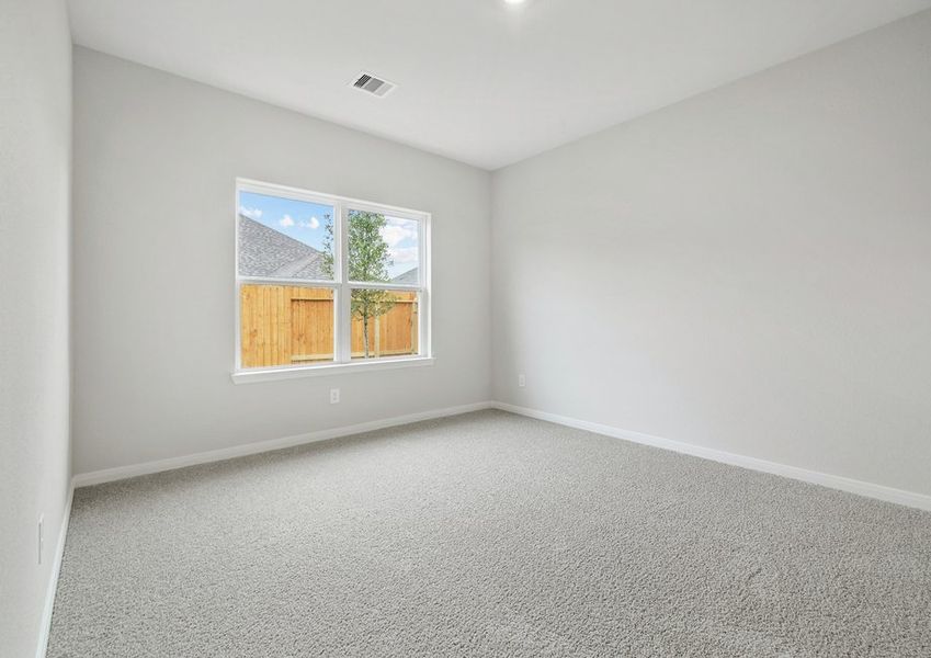 Master bedroom with a window over looking the backyard Master bedroom with a window over looking the backyard