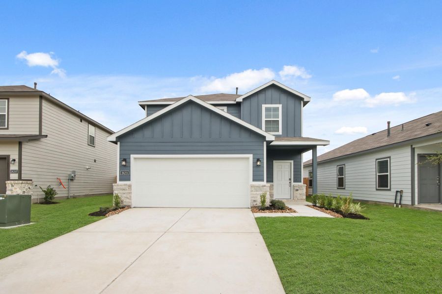 Front exterior of a new home in Northpark South, Porter, TX, highlighting curb appeal (Image 13). Front exterior of a new home in Northpark South, Porter, TX, highlighting curb appeal (Image 13).