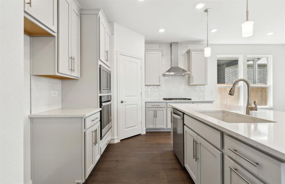 High-end gourmet kitchen with premium finishes and upgraded appliances High-end gourmet kitchen with premium finishes and upgraded appliances