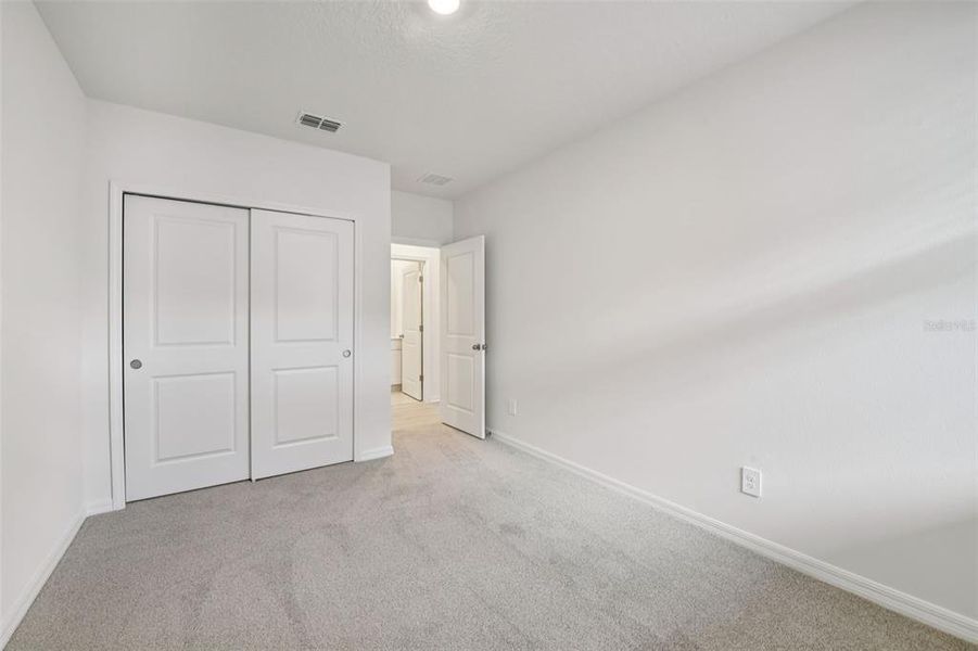 Spacious, unfurnished interior of a new home in Ridgehaven - Villas, Ormond Beach (Image 19).