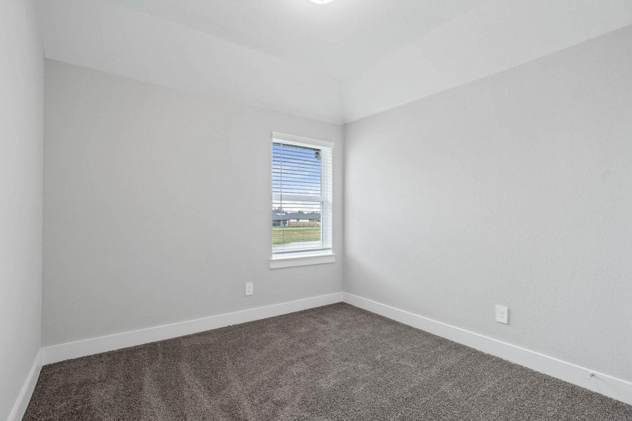 This cozy secondary bedroom offers plush, soft carpeting, neutral walls ready for personalization, a sun-filled window, and a spacious closet for all your storage needs. This cozy secondary bedroom offers plush, soft carpeting, neutral walls ready for personalization, a sun-filled window, and a spacious closet for all your storage needs.