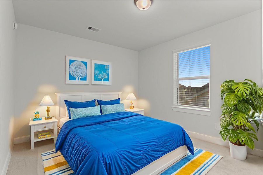 Virtually staged: Another bedroom highlights flexible space for any lifestyle—whether as a personal retreat, study, or creative room—with abundant light and plush carpeting for everyday comfort. Virtually staged: Another bedroom highlights flexible space for any lifestyle—whether as a personal retreat, study, or creative room—with abundant light and plush carpeting for everyday comfort.