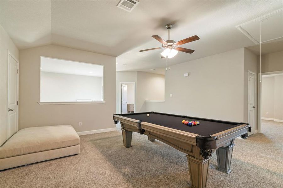 Rec room with carpet, vaulted ceiling, billiards table, and ceiling fan Rec room with carpet, vaulted ceiling, billiards table, and ceiling fan