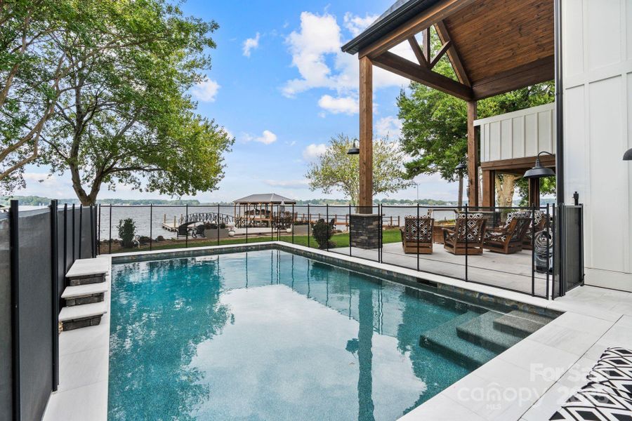 Sleek, rectangular, heated, salt-water pool with water feature Sleek, rectangular, heated, salt-water pool with water feature