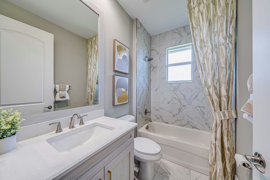 Representative furnished interior of a home built from the Cecelia 43 by GHO Homes in Tesoro Club, Port St. Lucie (Image 13).