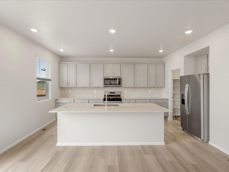 Front exterior of a new home in Paint Brush Hills, Peyton, CO, highlighting curb appeal (Image 2).