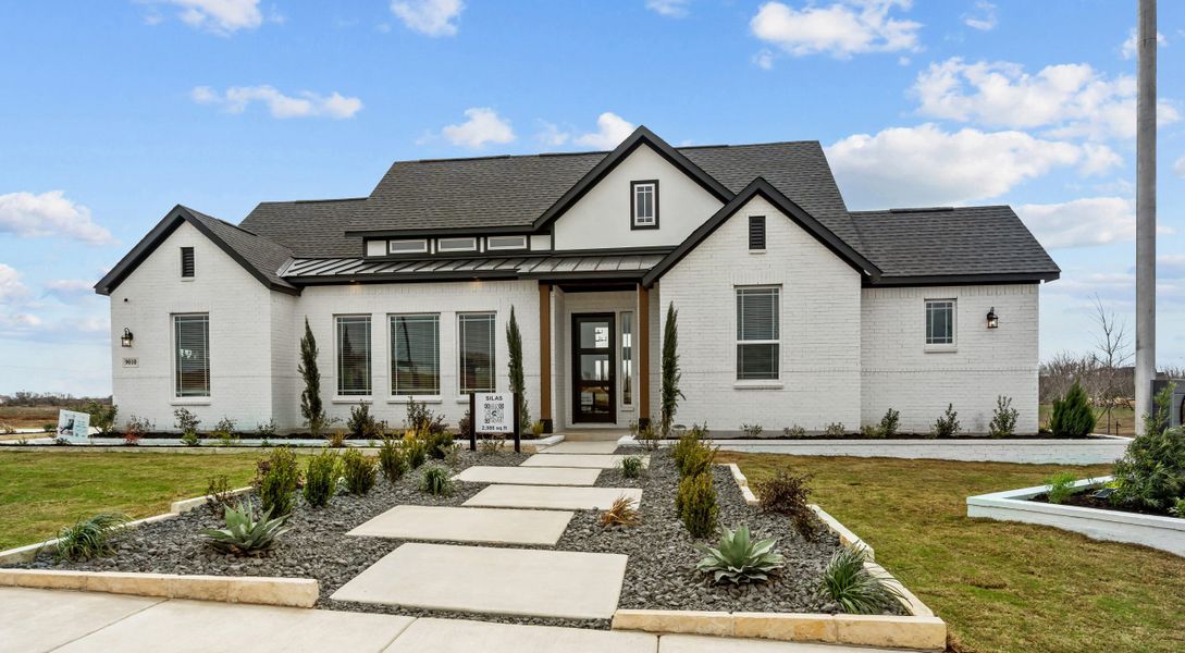 Front exterior of a home in the Sienna Lakes community, located in San Antonio, TX (Image 12).