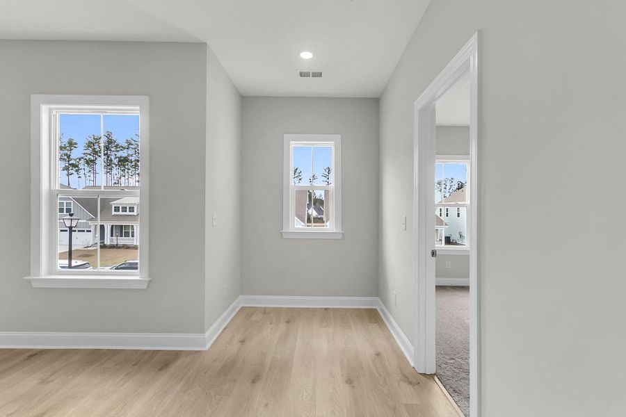 Spacious, unfurnished interior of a new home in Tidewater at Lakes of Cane Bay, Summerville (Image 54).