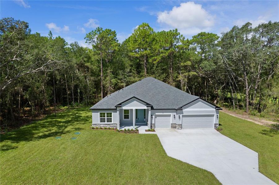 Front exterior of a new home in , Lecanto, FL, highlighting curb appeal (Image 28). Front exterior of a new home in , Lecanto, FL, highlighting curb appeal (Image 28).