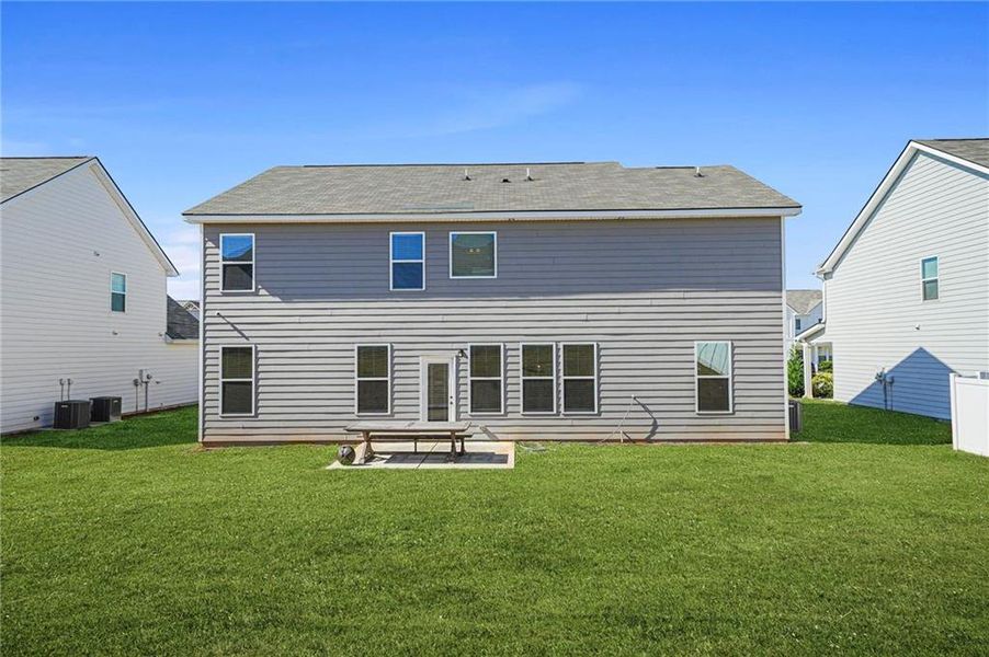 Exterior details and patio area of a home in Berkeley Lakes, Locust Grove (Image 29).