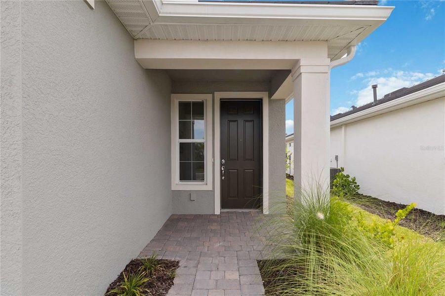 Front exterior of a new home in , Englewood, FL, highlighting curb appeal (Image 19).
