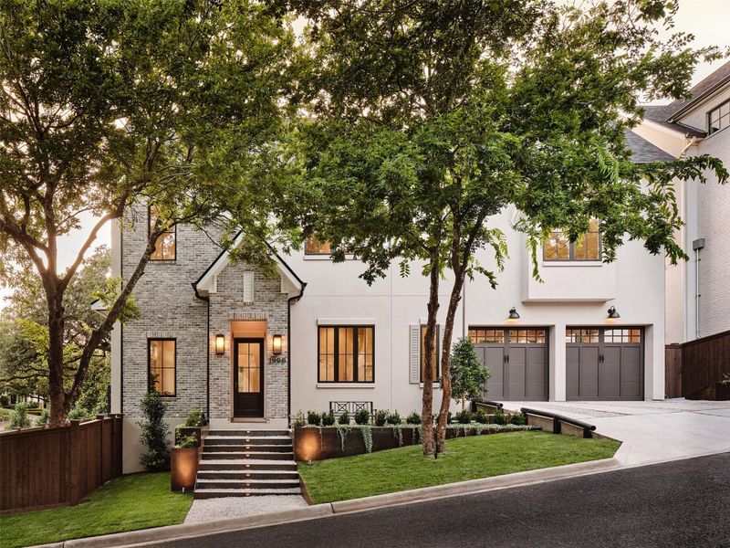 Grand entry stairs with shaded entry. Landscape lighting. Two car private carport.  Two offstreet parking spaces in driveway. Upgraded wood privacy fence.