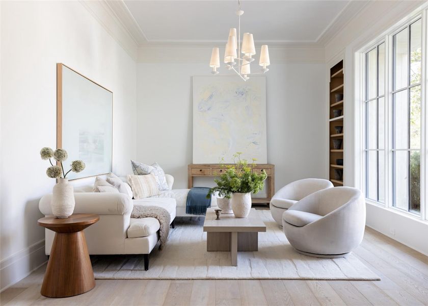 The formal study features detailed crown molding, abundant natural light, and a custom built-in shelf The formal study features detailed crown molding, abundant natural light, and a custom built-in shelf