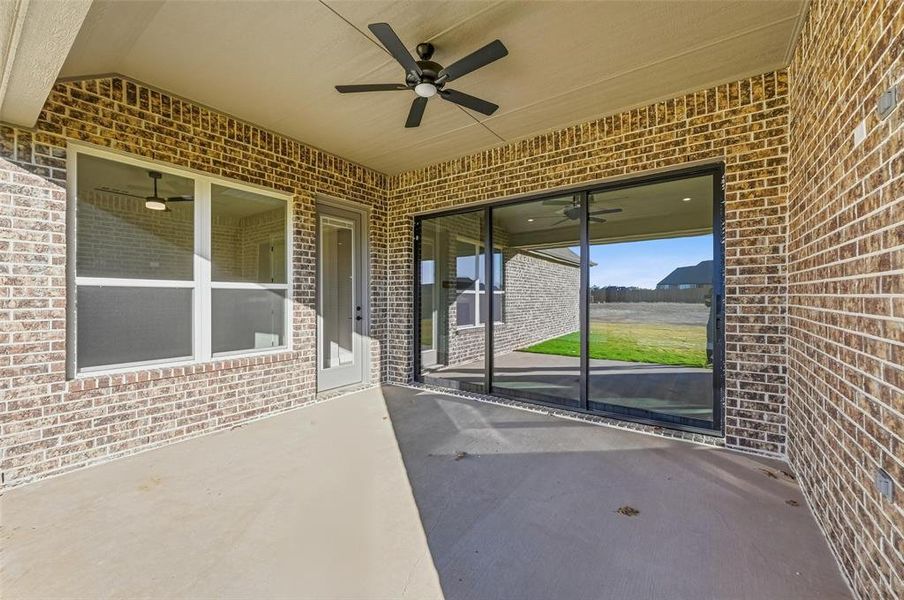 Exterior details and patio area of a home in Coyote Crossing, Godley (Image 24).