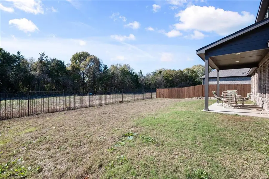 Exterior details and patio area of a home in Massey Meadows, Midlothian (Image 16).