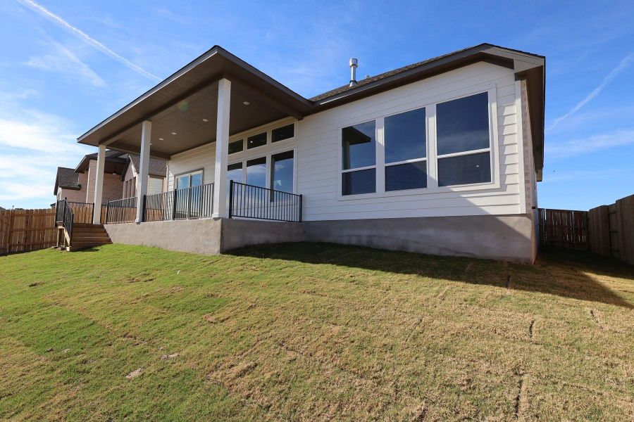 Exterior details and patio area of a home in Lariat, Liberty Hill (Image 19).
