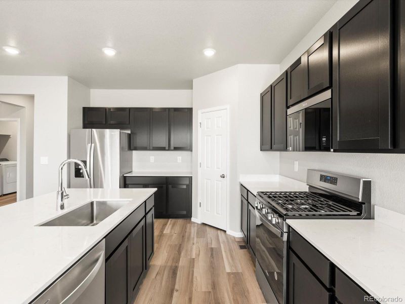 Furnished interior view inside a new home in , Commerce City (Image 4).