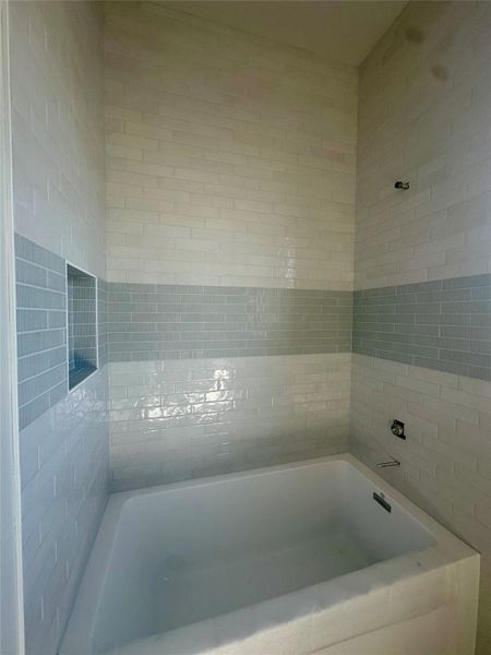 Bathroom featuring a tub Bathroom featuring a tub