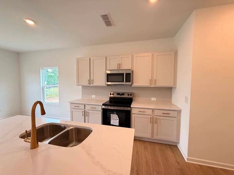Furnished interior view inside a new home in Leydenview, Mableton (Image 5).