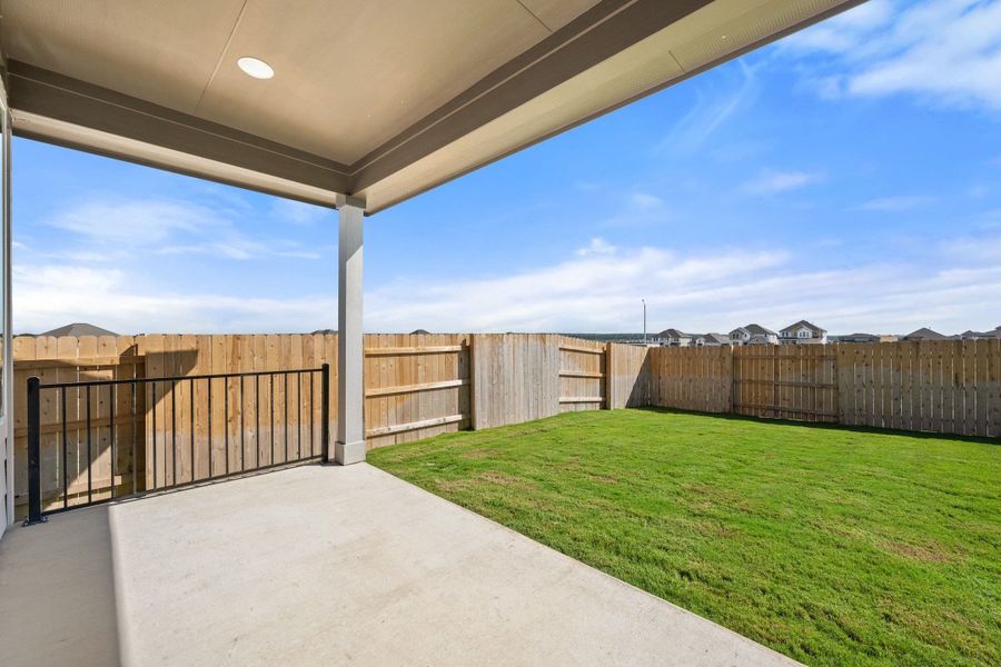 Exterior details and patio area of a home in Lariat, Liberty Hill (Image 4).