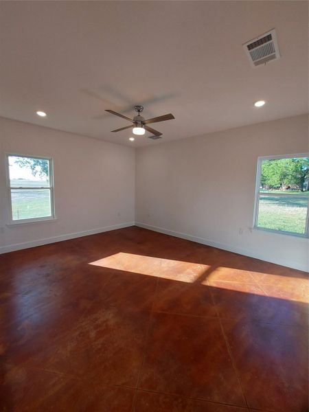 Master Bedroom room with a Ceiling Fan and Recessed lighting.Lots of Natural Light in the Master.