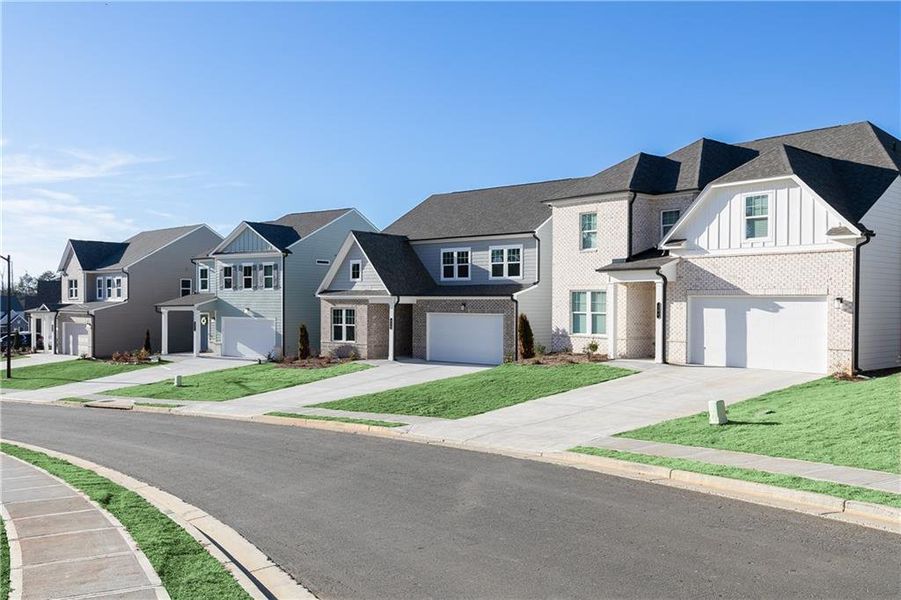 Front exterior of a new home in Kingsley, Acworth, GA, highlighting curb appeal (Image 21).