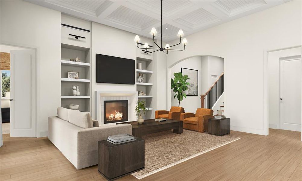 Built-in shelving frames the gas log fireplace in this beautiful open concept living room.