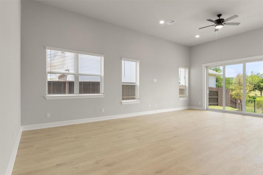 Empty room with light wood finished floors, recessed lighting, and ceiling fan