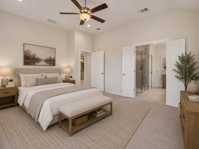 Discover comfort in this bedroom featuring a vaulted ceiling and an attached private bathroom.