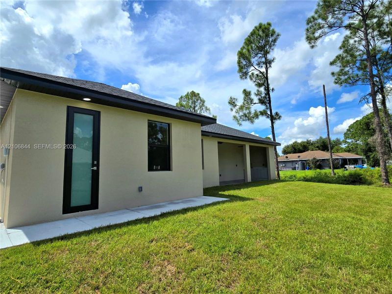 Exterior details and patio area of a home in , Lehigh Acres (Image 4). Exterior details and patio area of a home in , Lehigh Acres (Image 4).