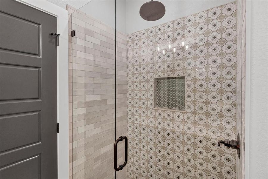 Full bathroom with a shower stall Full bathroom with a shower stall