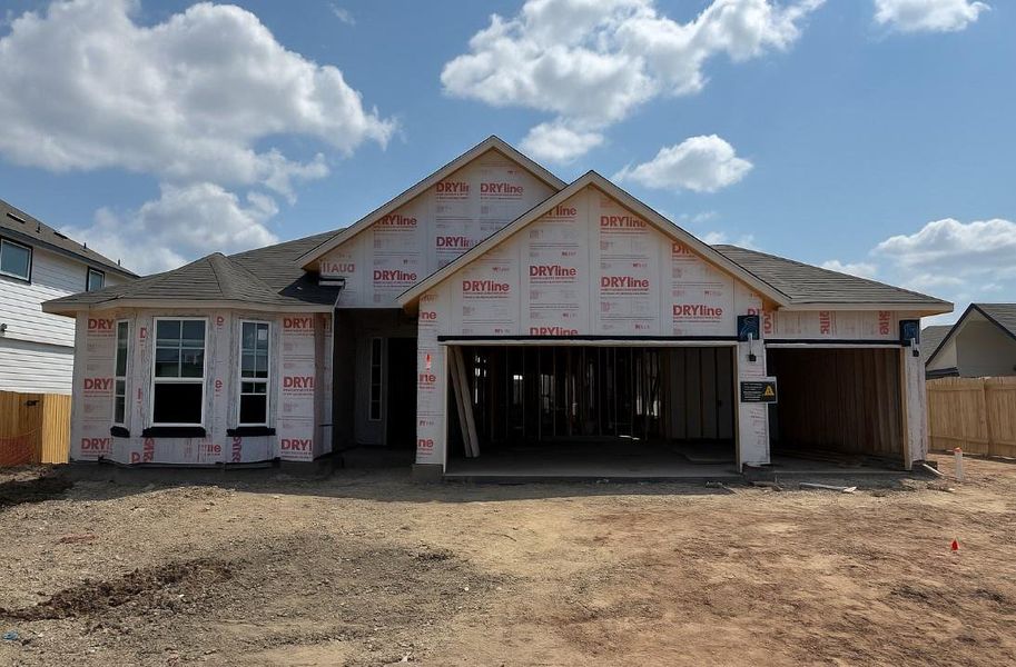 Unfinished property featuring a garage Unfinished property featuring a garage