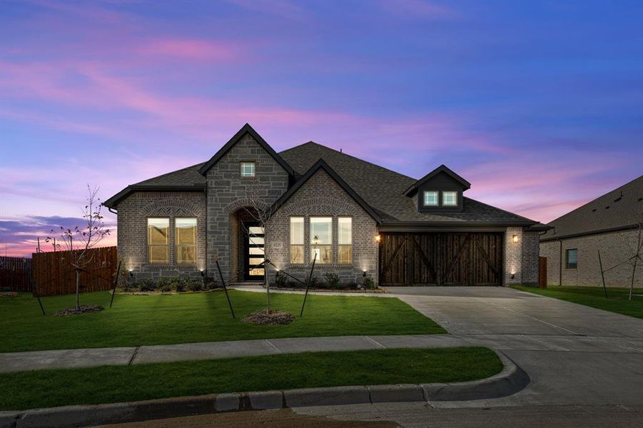 Front exterior of a new home in Villages of Walnut Grove, Midlothian, TX, highlighting curb appeal (Image 2).